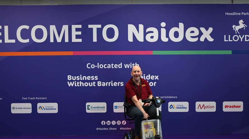 Gavin Clifton, in front of a banner for Naidex 2026